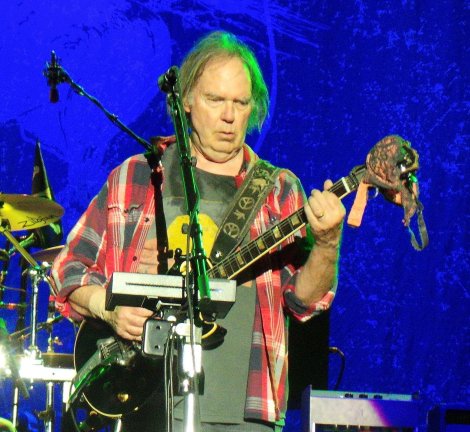 SHOWING SUPPORT: Neil Young drapes my friend Mel's bra over his legendary 'Old Black' guitar. It was for his encore of 'Roll Another Number'.