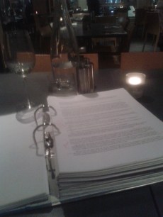 WINE AND PROOFING: An image taken during the proofing of one of Enormity's drafts.